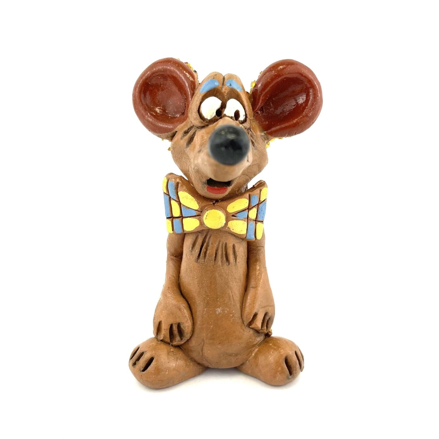 Clay mouse figurine with large ears and a colorful bow tie on a white background