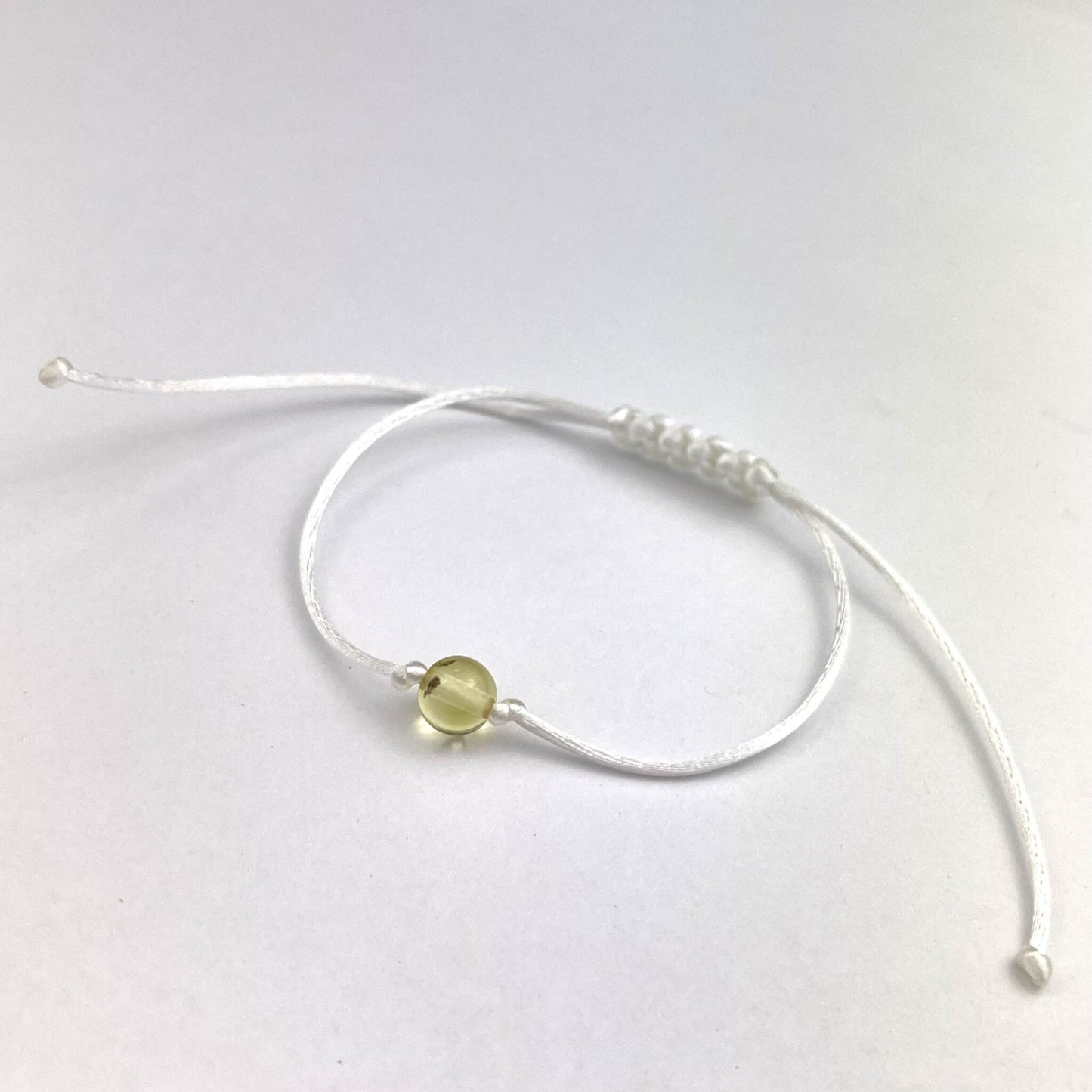 Polished White Adjustable Bracelet with Amber Bead