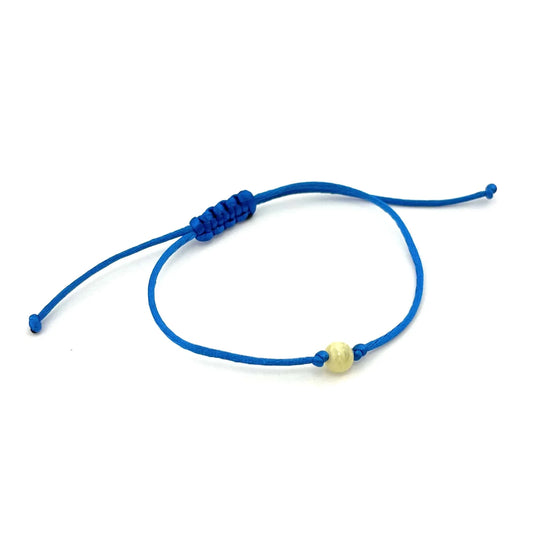 Polished Blue Adjustable Bracelet with a Butter Color Amber Bead