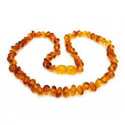 Polished baby semi rounded dark honey color necklace