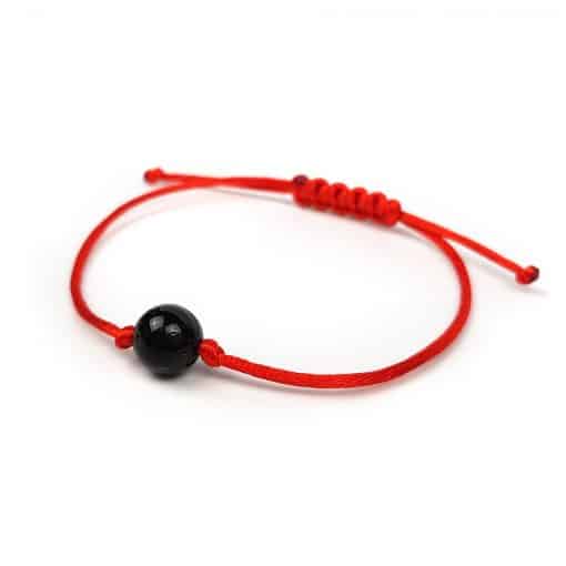 Polished Adjustable bracelet with a black bead